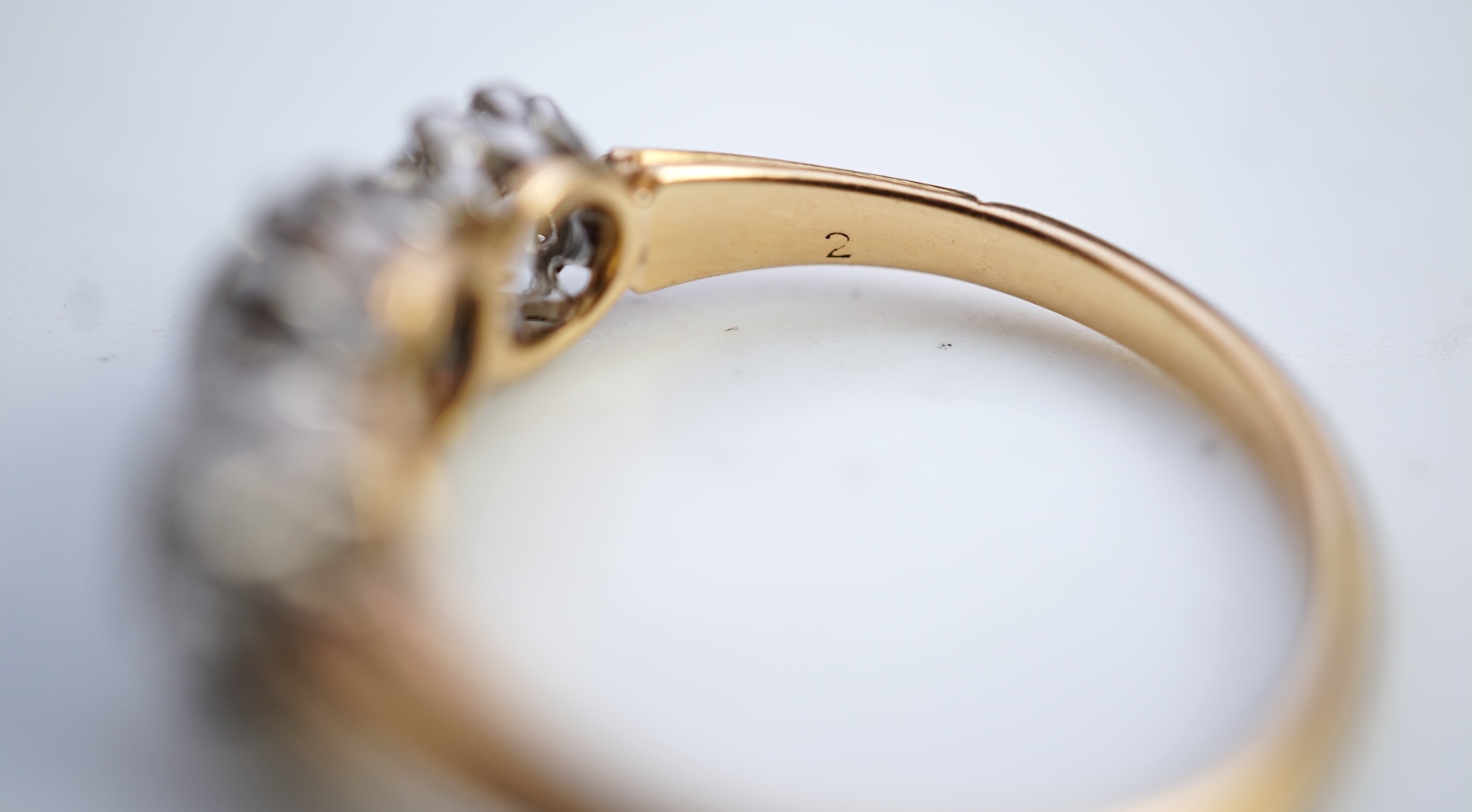 An attractive three-stone diamond ring, early 20th century